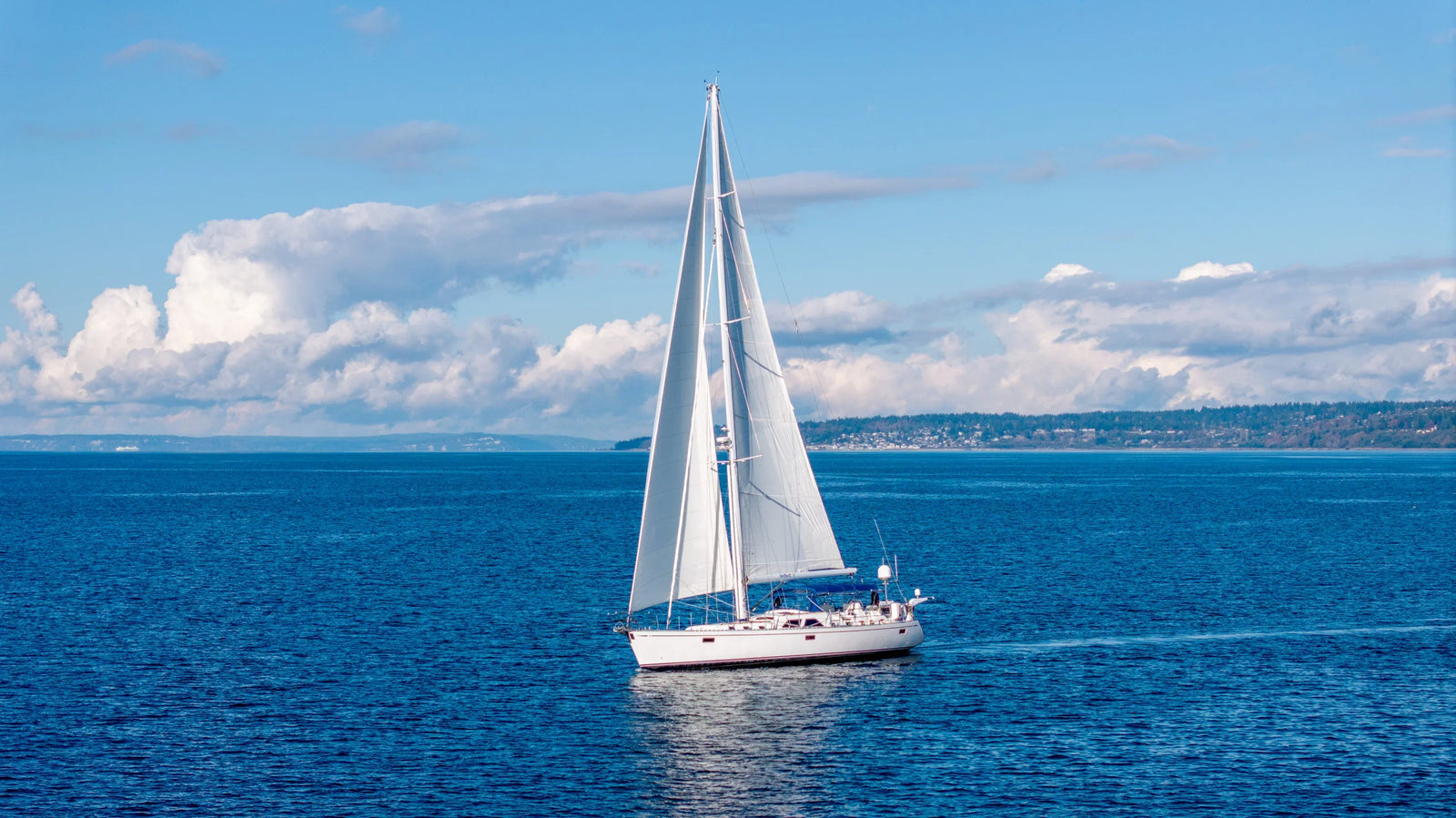 Sailboat Aerial in the Puget Sound with Cloud Landscape